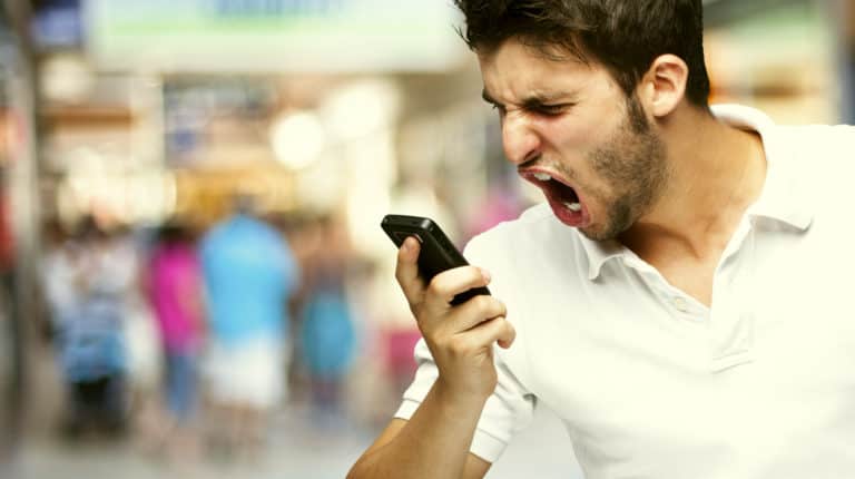 Feature | Angry young man shouting | Ways You Are Being Rude With Your Cell Phone | bad cell phone habits